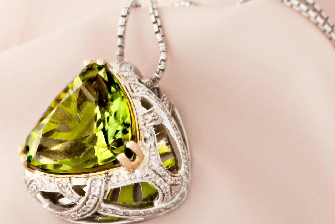 Close-up of a peridot pendant necklace