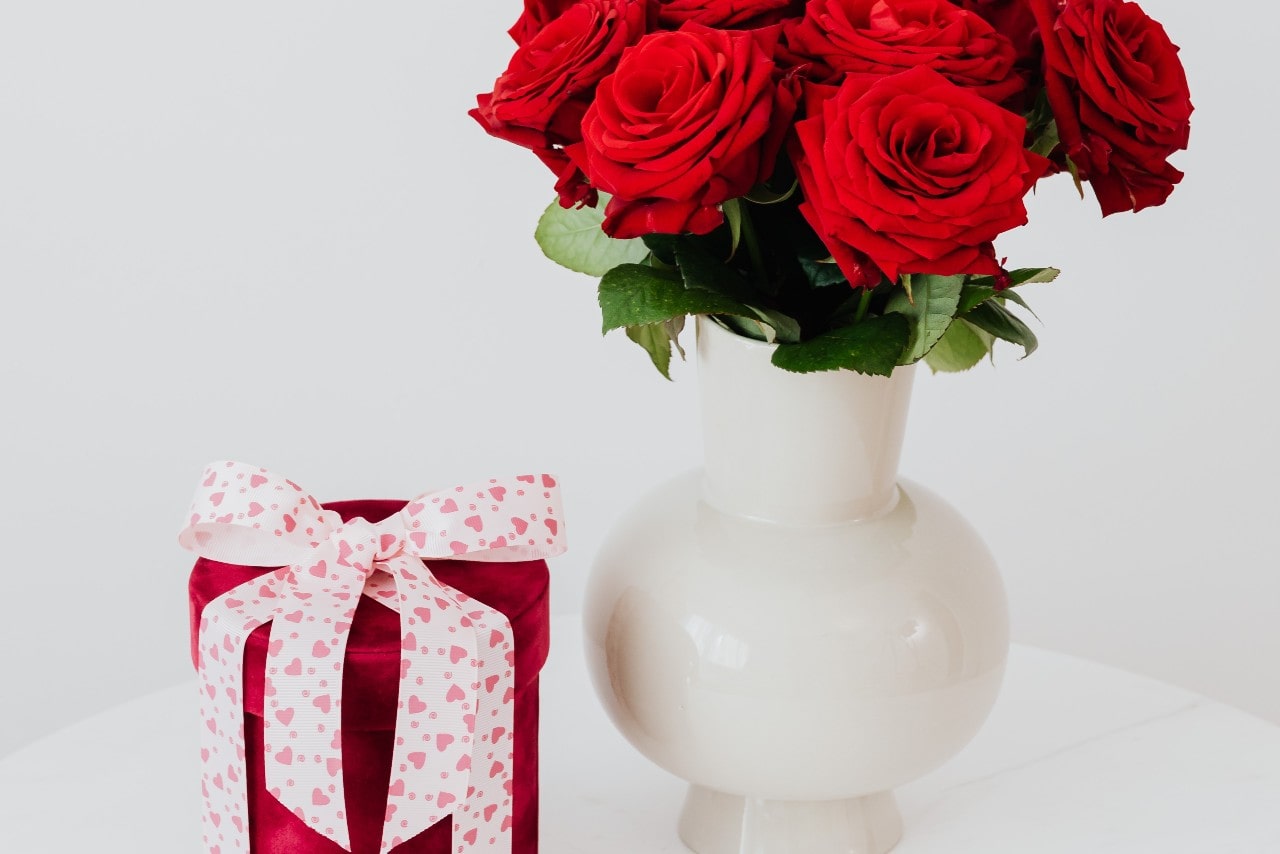 a red gift box and red roses