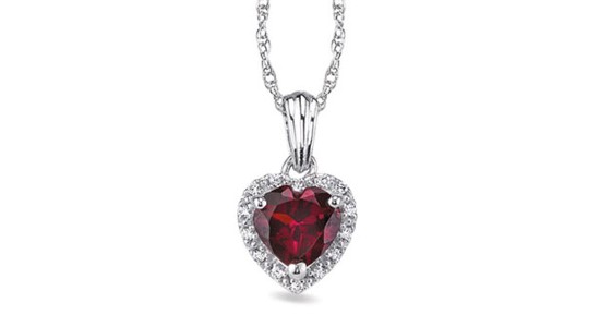 A white gold pendant necklace featuring a halo set, heart shaped ruby, available at Morgan Jewelers.