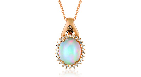 a strawberry gold pendant necklace featuring an oval cut opal