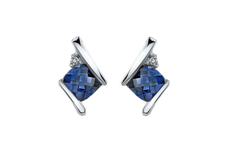 A close-up of a pair of elegant sapphire stud earrings, available at Morgan Jewelers.