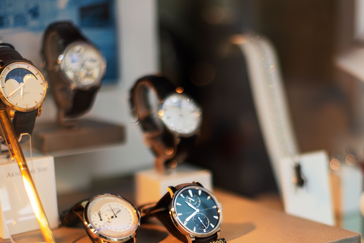 A close-up display of luxury wristwatches in a boutique window.