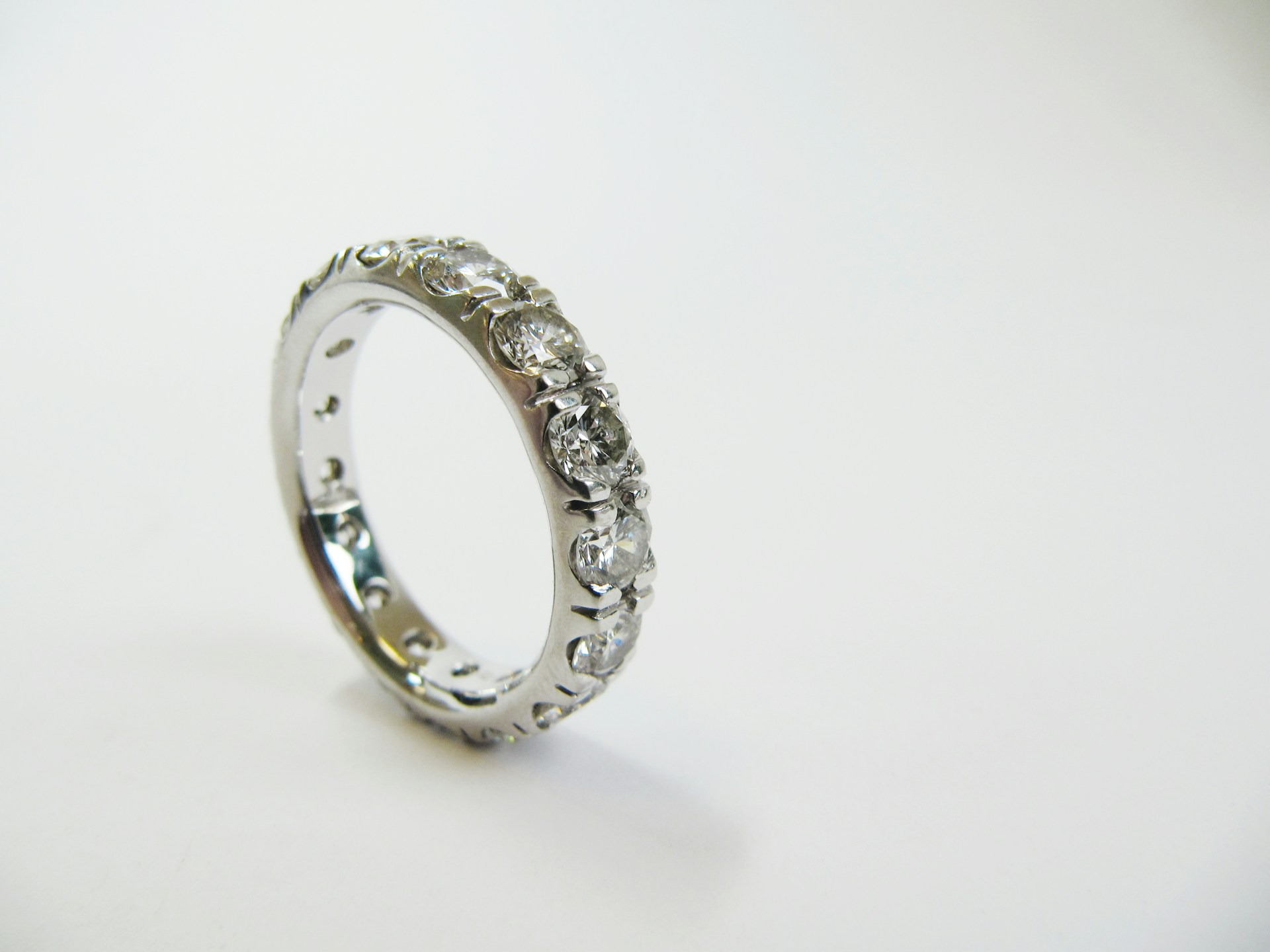 a white gold diamond eternity ring held with prongs